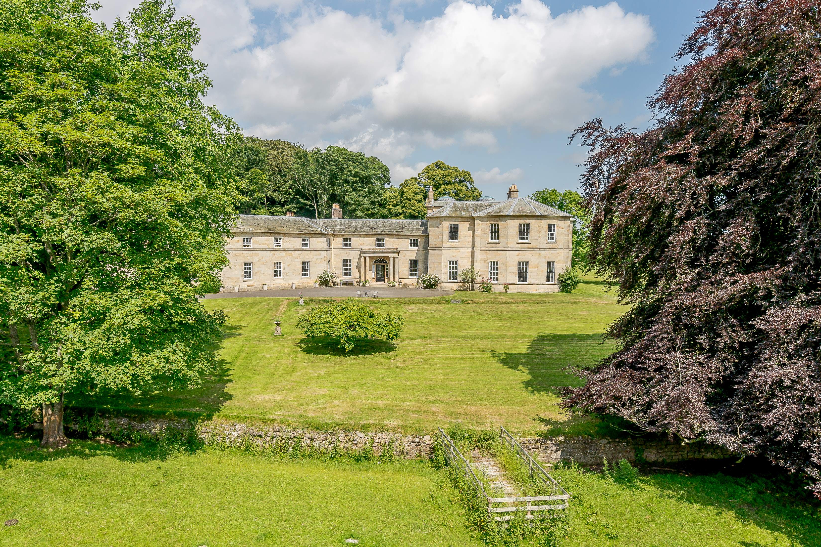 Milbourne_Hall_EXT_THROUGH_TREES.jpg